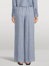Load image into Gallery viewer, Person wearing a blue checkered outfit with wide-leg pants on a white background