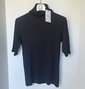 Black turtleneck shirt on a hanger with a white background