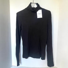 Load image into Gallery viewer, Black turtleneck sweater on a hanger with a visible brand tag against a white background
