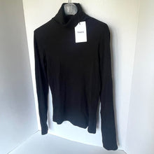 Load image into Gallery viewer, Black turtleneck sweater on a hanger with a visible brand tag against a white background