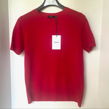 Load image into Gallery viewer, Red t-shirt on a hanger with a &#39;Theory&#39; tag against a white background