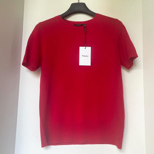 Red t-shirt on a hanger with a 'Theory' tag against a white background