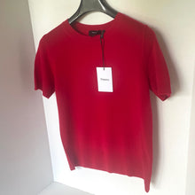 Load image into Gallery viewer, Red t-shirt with a &#39;Theory&#39; tag on a hanger against a white background