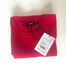 Load image into Gallery viewer, Folded red sweater with a tag on a white background