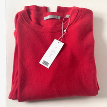 Load image into Gallery viewer, Folded red sweater with a tag on a white background