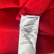 Load image into Gallery viewer, Close-up of a red garment with a white 'Vince' label.