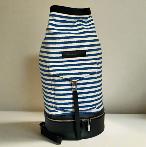 Blue and white striped bag with black accents on a plain background