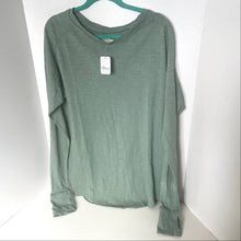 Load image into Gallery viewer, Green long-sleeve shirt on a hanger with a white background