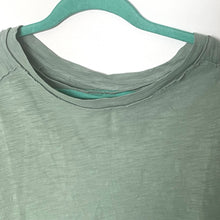 Load image into Gallery viewer, Green shirt on a hanger with a white background