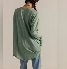 Load image into Gallery viewer, Person wearing a green long-sleeve shirt and blue jeans against a plain background
