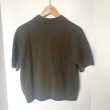 Load image into Gallery viewer, Gray t-shirt on a hanger against a white wall
