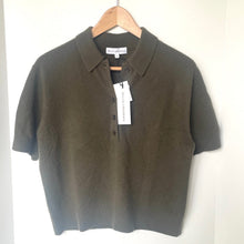 Load image into Gallery viewer, Green polo shirt on a hanger against a white background