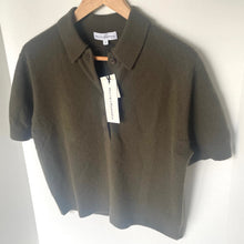 Load image into Gallery viewer, Brown polo shirt on a hanger with a visible tag against a white background