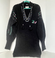 Load image into Gallery viewer, Black sweater with colorful patterns on a white background