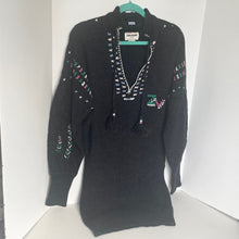 Load image into Gallery viewer, Black sweater with colorful patterns on a white background