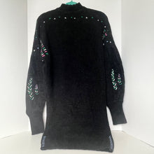 Load image into Gallery viewer, Black sweater with colorful patterns on sleeves against a white background