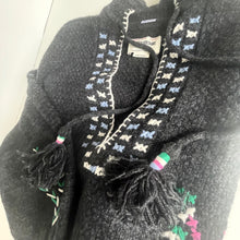 Load image into Gallery viewer, Dark gray coat with colorful patterned trim and tassels on a white background