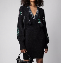 Load image into Gallery viewer, Black knitted dress with patterned details worn by a model on a gray background