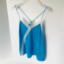 Load image into Gallery viewer, Blue lace camisole on a hanger against a white background