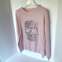 Load image into Gallery viewer, Pink sweater with skull design on a white background