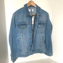 Load image into Gallery viewer, Blue denim jacket on a wooden hanger against a white background