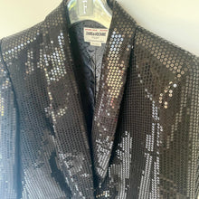 Load image into Gallery viewer, Black sequin jacket on a hanger with a visible brand label.