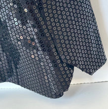 Load image into Gallery viewer, Close-up of a black sequin fabric with a white background