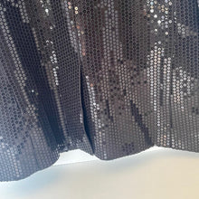 Load image into Gallery viewer, Close-up of a sequined fabric with a dark background