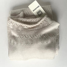 Load image into Gallery viewer, Folded beige knitted blanket with a brand tag on a light gray background
