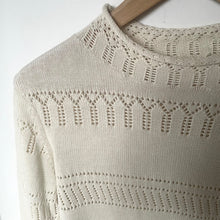 Load image into Gallery viewer, Beige knitted sweater with intricate pattern on a white background