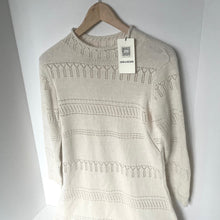 Load image into Gallery viewer, Beige sweater on a hanger with a visible tag against a white background