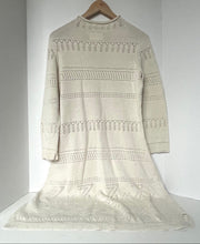 Load image into Gallery viewer, Beige knitted dress on a hanger against a white background