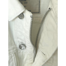 Load image into Gallery viewer, Close-up of a white denim jacket with a zipper and brand logo.
