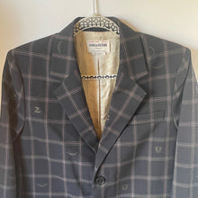 Load image into Gallery viewer, Plaid suit jacket on a hanger with a visible brand label.