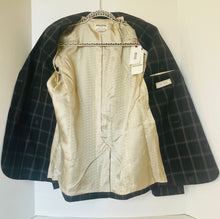 Load image into Gallery viewer, Beige dress with a black checkered jacket on a white background
