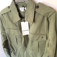 Load image into Gallery viewer, Green jacket with a tag on a white background