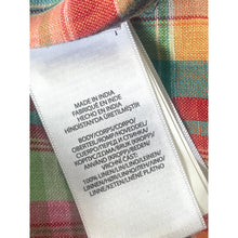 Load image into Gallery viewer, Fabric tag with text on a multicolored fabric background