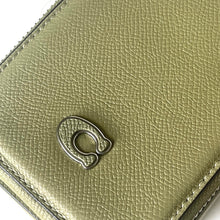 Load image into Gallery viewer, Close-up of a green leather wallet with a metal ring on a white background