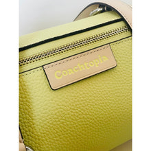 Load image into Gallery viewer, Green handbag with 'Coachtopia' label on a white background