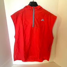 Load image into Gallery viewer, Red sleeveless jacket with a brand logo on a mannequin against a neutral background