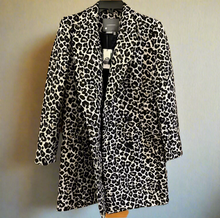 Load image into Gallery viewer, Leopard print coat on a hanger against a wooden door background