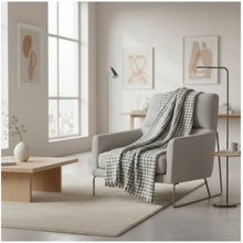 Load image into Gallery viewer, Modern living room with a gray armchair, checkered blanket, and minimal decor.