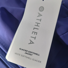 Load image into Gallery viewer, Athleta Glacier Softshell Jacket tag on a blue jacket