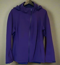 Load image into Gallery viewer, Purple jacket on a hanger against a white wall