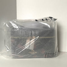 Load image into Gallery viewer, Coach handbag in clear plastic packaging on a white background