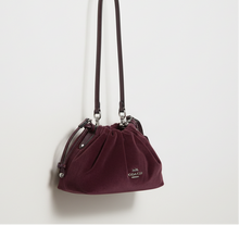 Load image into Gallery viewer, Maroon handbag with a strap on a white background