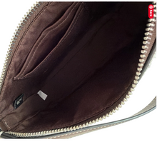 Load image into Gallery viewer, Close-up of a brown leather bag with a visible brand logo.