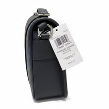 Load image into Gallery viewer, Black leather product with a white tag displaying text and a barcode on a wooden surface.