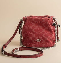 Load image into Gallery viewer, Red Coach handbag with chain strap on a marble surface