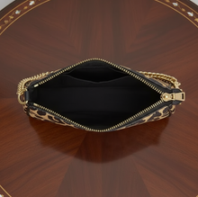 Load image into Gallery viewer, Open clutch bag with floral pattern and gold zipper on a white background